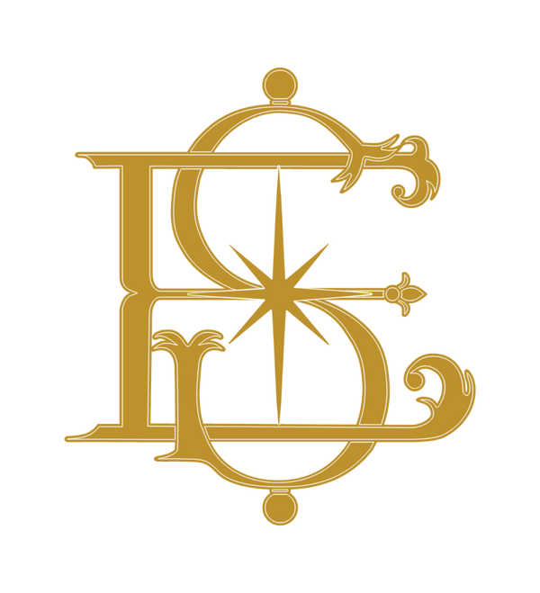 Gold decorative interlocking ES monogram for Epiphania Studio on a neutral background